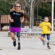 Sarah Reinertsen runs mentors Morgan Pixley, age 5